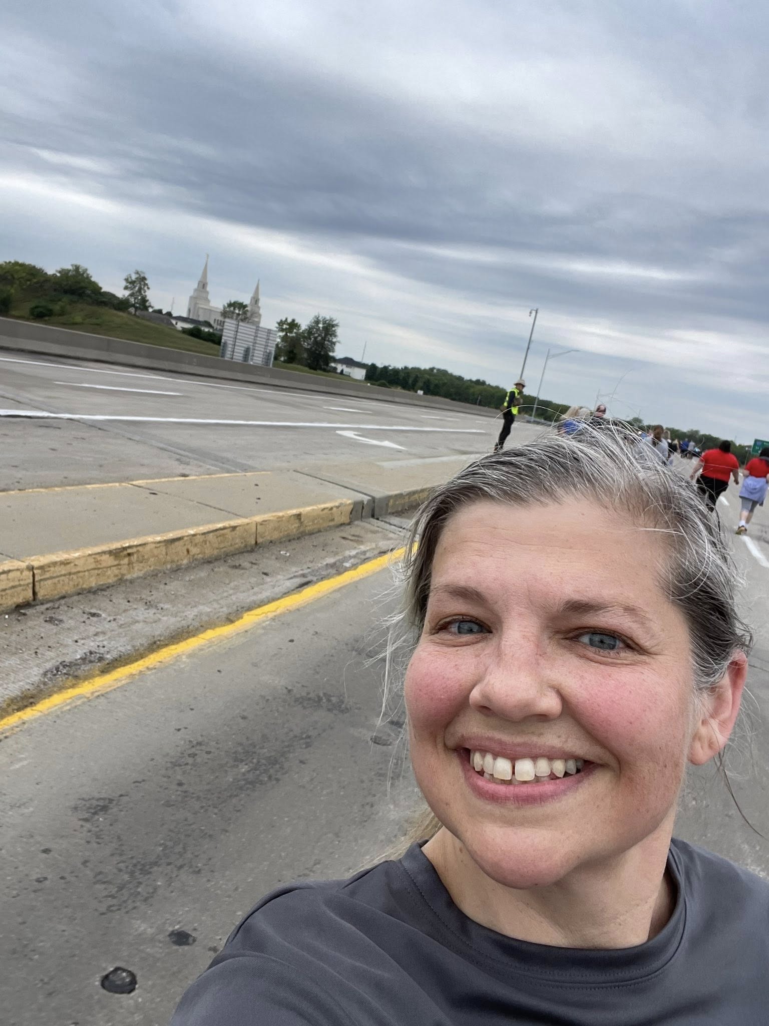 Angela smiling during a community 5K event